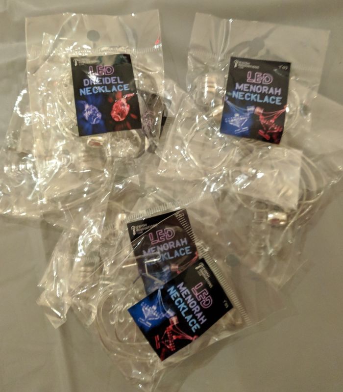 LED menorah necklace in packaging
